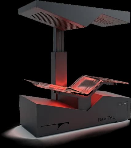 The ReVITAL suite: a reclined bed under a red-lit canopy.